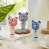 Three cartoon bear-shaped portable fans are available in pink, gray, purple, blue and white. They are decorated with paw prints and have a detachable base details Picture